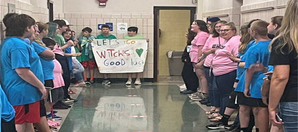Students in K-6 line the halls to cheer on our teams!
